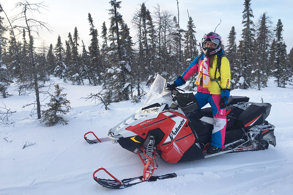 Ashlyn on a snowmobiling in northeast Saskatchewan