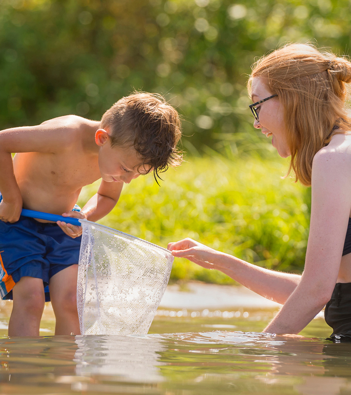 Woman and child using a net to sift water